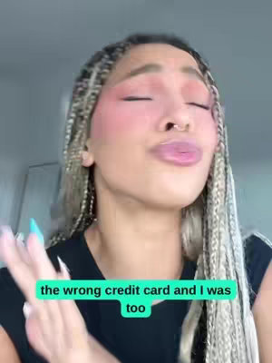 A close-up shot of a woman with braided hair and makeup. She is looking upwards with her eyes closed, and her lips are slightly pursed. Overlayed on the image is a green-boxed text that reads: the wrong credit card and I was too.