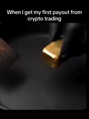 The image shows a close-up of a hand wearing a black glove holding a gold bar. The bar is held against a dark, blurred background. Above, white text overlays the scene, and the bar is well-lit and catches the light, appearing to be made of gold.