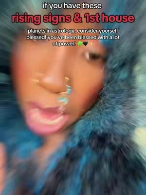A selfie-style video cover. The image is centered on the face and upper body of a person with dark skin. They are wearing a nose ring and earrings. The background is blurred, and the primary colors are shades of blue and orange, with a slightly blurred and dreamy effect. Above the person's head is overlaid text that offers a statement about astrology.