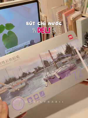 The cover image shows a desk scene with a partially opened pencil case displaying 72 colored pencils. A tablet with a screen showing leaves and some text, along with some notebooks and other stationery items, are visible. The overall ambiance suggests a study or creative workspace.
