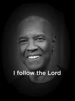 A black and white image features a smiling man with a shaved head, set against a dark oval-shaped backdrop. The words 'I follow the Lord' are written in a simple, white font at the image's base.
