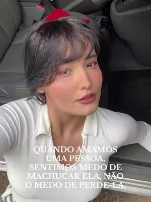 The cover image is a selfie featuring a woman with short dark hair and subtle makeup, set inside a vehicle. The woman is looking at the camera with a thoughtful expression. Text overlayed on the image is a quote from the woman reflecting a relationship-focused poem.
