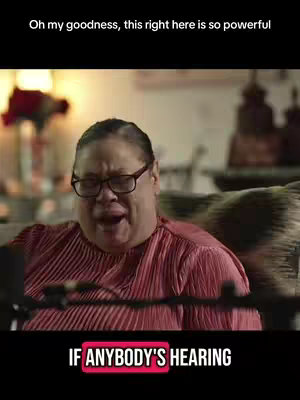 The cover image shows a woman seated indoors, looking upward with an open mouth and an expression of emotion. She wears glasses and a red top, and the background includes blurred indoor elements. Overlayed at the bottom is a black bar with white text.