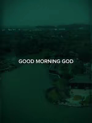 The cover image is vertically oriented. At the center is a text overlay that reads "GOOD MORNING GOD" in white font. The background appears to be a landscape view, with a body of water reflecting a darker, cloudy sky. The overal tone is dark green.