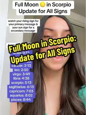 A woman with long dark hair smiles at the camera. The image is overlaid with text in a colorful, bubbly font, advertising a full moon in Scorpio update. Further text lists the times for each zodiac sign.