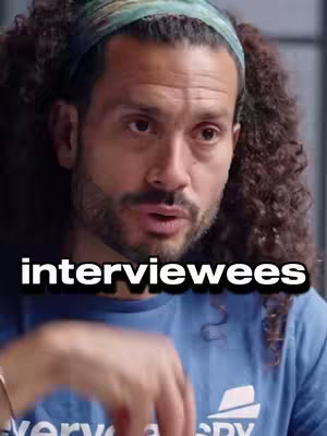 A medium shot features a man with curly hair and a headband looking directly at the camera. The text overlay reads "interviewees".