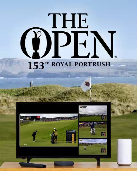 A television displays multiple angles of a golf tournament, with a green landscape and a body of water in the background, along with  the words "THE OPEN" and other text displayed on the cover image.