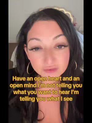 The cover image features a woman with long dark hair and large hoop earrings, looking directly at the camera. The background is a neutral color. Text overlayed on the image reads, "Have an open heart and an open mind I'm not telling you what you want to hear I'm telling you what I see".