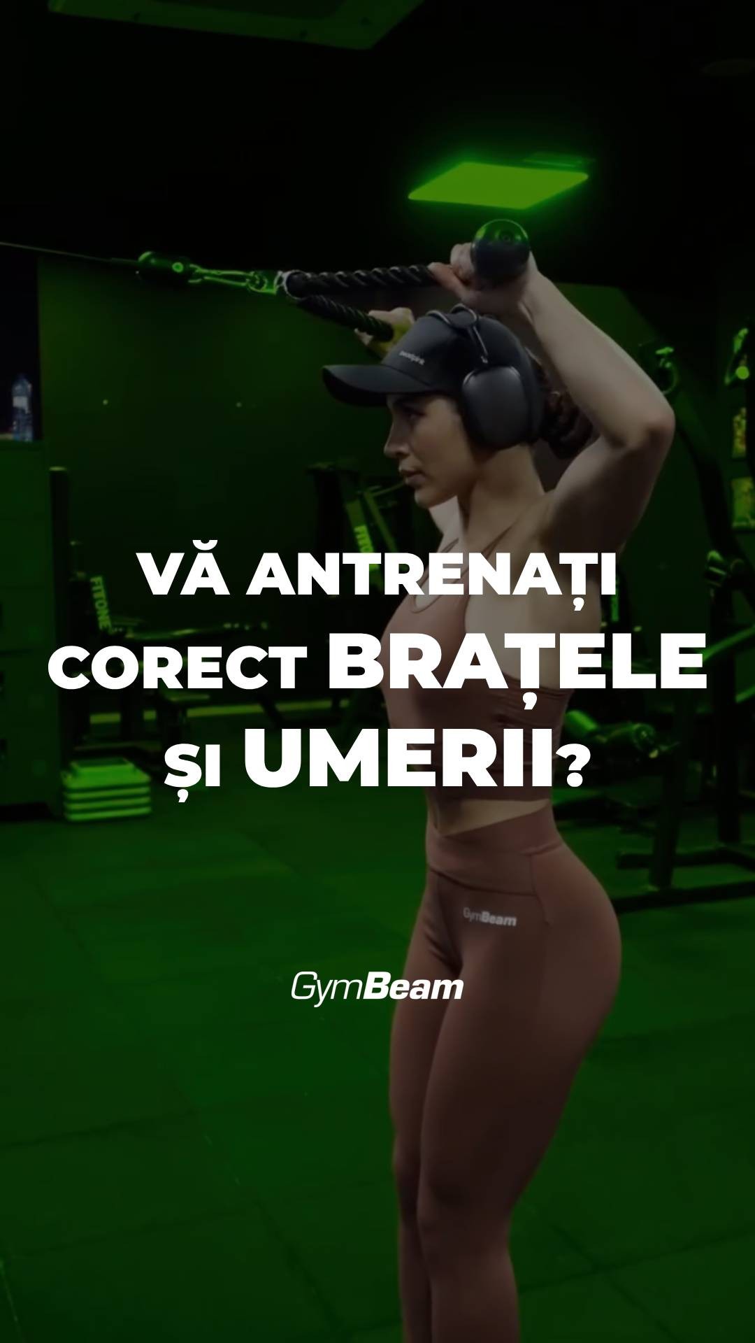 A woman is shown in profile, wearing a black cap and ear protection, working out in a gym. Bold white text overlays the image, posing a question about working out muscles correctly above the GymBeam logo. The background is a dark green, suggesting a gym environment.