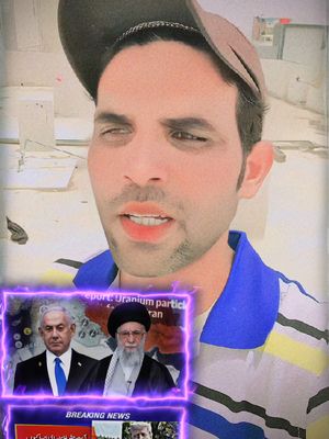 A man in a blue and yellow striped shirt, wearing a backwards brown cap, is recording a video with a background of rooftops. The video includes an overlay of an image with two men on it, framed by a glowing purple border, and a lower bar labeled 'BREAKING NEWS'.