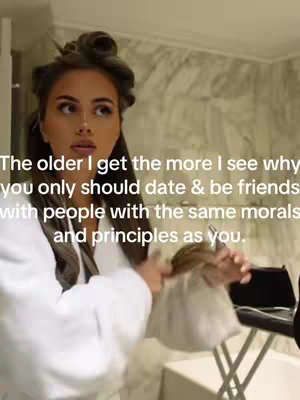 The cover image shows a woman in a bathroom, with her hair in curlers, looking up thoughtfully. Text overlayed onto the image presents a reflective statement on dating and relationships.