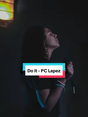 The image features a person cupping their hands in front of their chest, with their eyes closed and head tilted slightly upward. The background is dark with a hint of light coming from a stained glass window on the upper portion of the scene. Text overlayed on the image reads 'Do It - PC Lapez'.