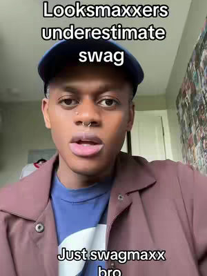 The cover image features a young Black man in a close-up shot. He is wearing a navy blue baseball cap and a maroon jacket over a blue shirt. Above him, white text on a black background states, "Looksmaxxers underestimate swag." Below him, the text "Just swagmaxx bro" is visible in white text on a black background.