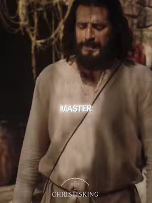 The image shows a man with long dark hair and a beard, dressed in a simple white garment. The background is blurred, suggesting an outdoor or rustic setting. The words "MASTER" are overlaid on the image in a glowing, stylized font.