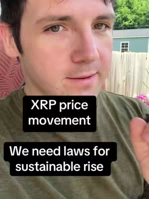 A man in a green shirt is centered in this vertical shot. Text boxes overlay the image near the bottom. His gaze is directed slightly off-camera, and he appears to be speaking, framed against a background of foliage and a portion of a building.