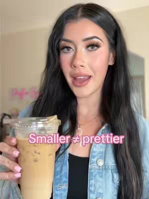A woman with long dark hair and makeup holds a cup of coffee, with the text "Smaller ≠ prettier" overlaid on the image.