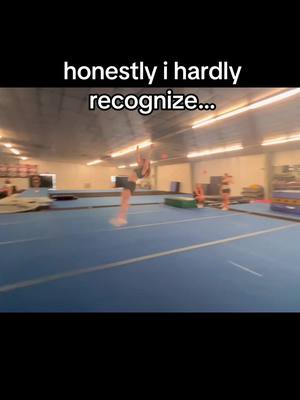 The cover image shows a person in mid-air, performing a tumbling skill in what seems to be a gymnasium. The floor is blue, and the walls are white. Text overlays the image at the top.