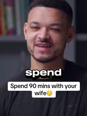 A man in a black shirt smiles and looks slightly to his left. A text overlay reads "spend" and a second box below says "Spend 90 mins with your wife" with a smiling face emoji.