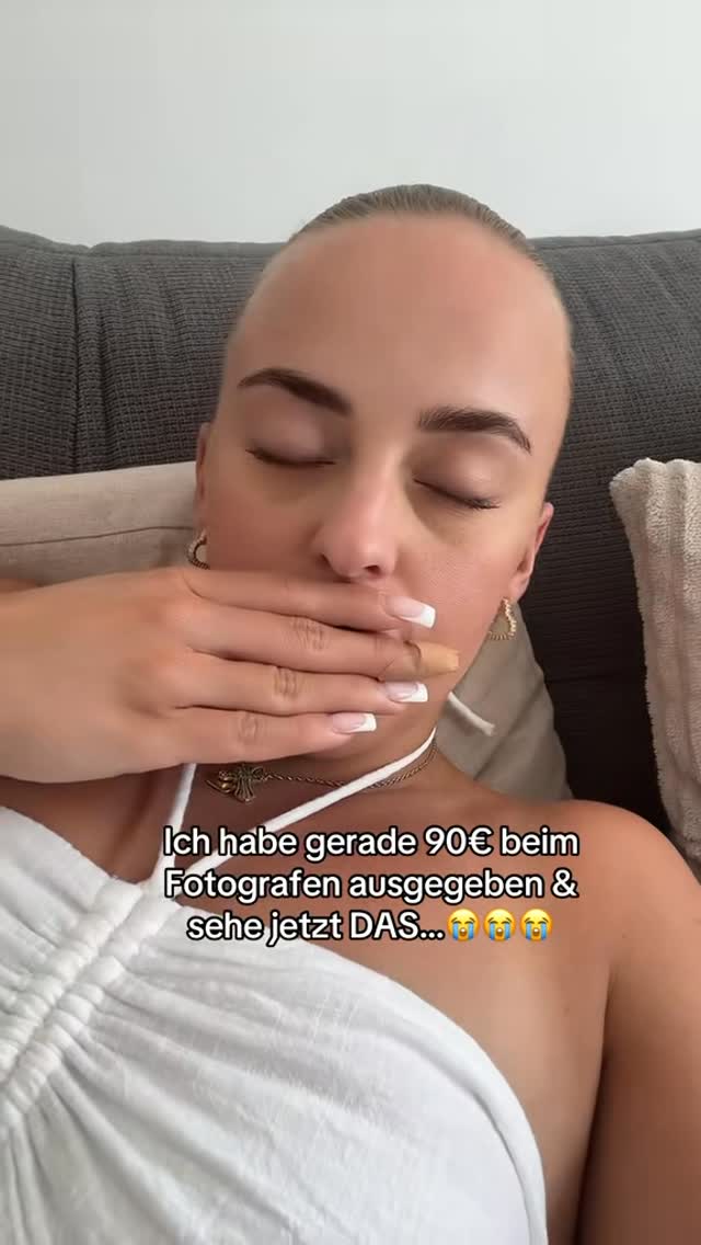 A selfie-style image featuring a woman's face; she is covering her mouth with her hand. The woman has light skin and is wearing a white top and jewelry. Text overlays are added to the image, indicating the creator's experience and feelings of being disappointed by something.