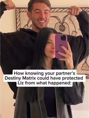 The image shows a couple posing for a selfie inside a well-lit room. The woman is centered holding the phone with a purple case, showing the right side of her face, her dark hear flowing down. The man is positioned behind her, flexing his arms and smiling. The background includes a textured design. An overlay at the bottom has white text against a black background.