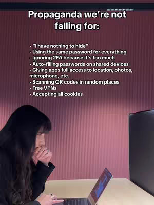 A woman with long dark hair is seated at a table in front of a laptop. Text overlaying the image lists several cybersecurity tips and warnings. The background is a textured pink wall, and a black object is on the right side of the image.