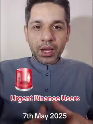 A man with short dark hair and a stubble beard is centered in the frame. Behind him, a simple, light-colored wall serves as the background. Overlayed on the image are the words 'Urgent Binance Users' in a red, rounded font, with a red siren graphic. Below the text reads '7th May 2025' in white text.
