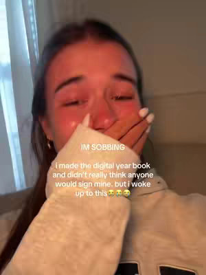 A close-up shot of a young woman's face, visibly emotional with tears streaming down her cheeks. She is holding her hand up to her mouth, partially covering her face. Text overlays the image, expressing her emotions.