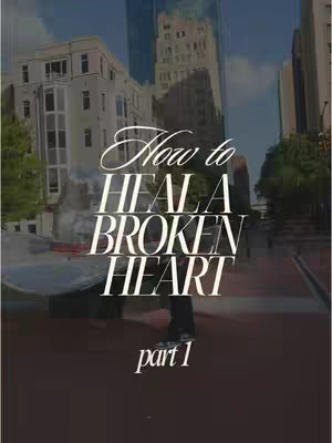 The cover image shows an urban landscape with tall buildings and a person standing in the middle. Overlayed in a stylish font are the words 'How to Heal a Broken Heart' and the text 'part 1'. The color palette is dominated by muted blues and greys.