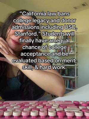 The image is a selfie where the creator is framed with the upper body visible and slightly angled to the right. A text overlay covers the top left, offering information on California law. The creator's face is partially obscured, with a focus on the lips, and hands resting near the face. A pink and white keyboard takes up the immediate foreground and a bookshelf background can slightly seen.