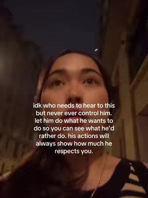 A selfie-style shot featuring a woman looking up towards the camera against a blurred background. Overlay text in white font is seen in the lower half of the image.