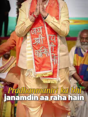 The image shows a man in traditional Indian attire with his hands in a prayer position. He is wearing a saffron-colored scarf with Hindi text. The bottom of the image features a text overlay in yellow, which is a hook.