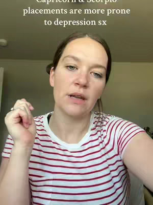 A woman with fair skin and light brown hair, wearing a red and white striped t-shirt, is speaking into the camera. Text overlayed on the image says "Capricorn & Scorpio placements are more prone to depression sx". The background is lightly blurred with neutral tones.