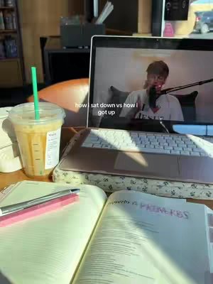 The cover image shows an inside shot. The left side features a half-filled Starbucks coffee cup with a green straw, next to an open notebook and a pen. In the background, a laptop displays a video of a person with a microphone. The laptop is open over a light-colored keyboard.