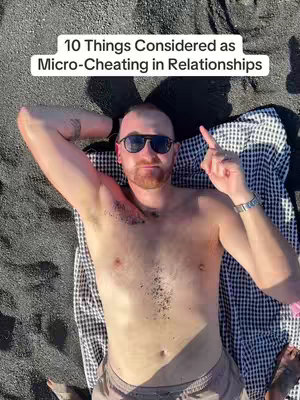 A man, shirtless, is lying on a black beach, his arms are behind his head with sunglasses on. The upper portion is showing from the thighs up, a gray and white checked towel lies beneath him. The text overlay at the top reads, “10 Things Considered as Micro-Cheating in Relationships.” The creator is pointing his finger up, with the index finger extended.