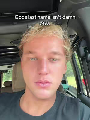 Image of a young man with light hair and fair skin in the front seat of a vehicle. Text overlayed at the top of the image. The background appears to be soft focus.
