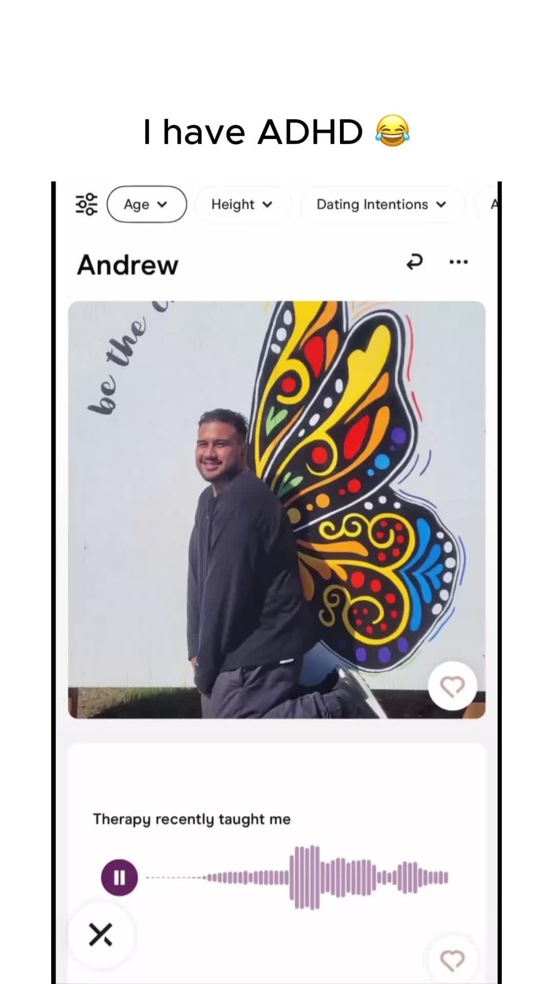 The cover image is a screenshot of a dating app profile, featuring a man with short dark hair and a beard smiling in front of a white wall on which there is a colorful butterfly mural on the right side. The text overlay reads "I have ADHD". The interface of the app shows profile info, including age check, height, the name "Andrew", and some icons, and a "pause" icon and a audio waveform. There's a heart icon at the bottom right corner of the profile photo.