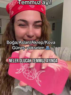 The image features a woman with brown hair wearing a red bandana, holding a deck of pink cards. Text overlays include Turkish phrases and astrological terms.