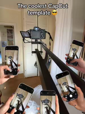 The cover image showcases a photography setup with a camera mounted on a crane, surrounded by multiple smartphones held by hands, capturing the scene. The background includes a room setting with a door and curtains, and the text overlay reads. The text is located at the top and center of the frame in a bold, sans-serif font, creating immediate recognition. The composition is focused on a photography setup and utilizes warm, natural lighting, enhancing the clarity and professionalism of the setup.
