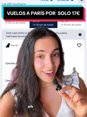 A woman is taking a selfie video, in front of a screen capture that shows flight information to Paris. The overlay shows some text in a bright solid color.