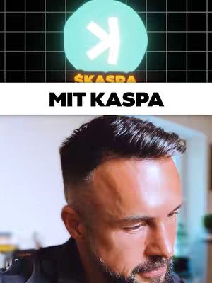 The cover image features a split composition. The top half shows a stylized, glowing blue circle with an arrow pointing right, above a black background. The bottom half shows the portrait of the creator , a man with short, dark hair, a groomed beard, and a serious expression. He appears in a well-lit indoor setting.