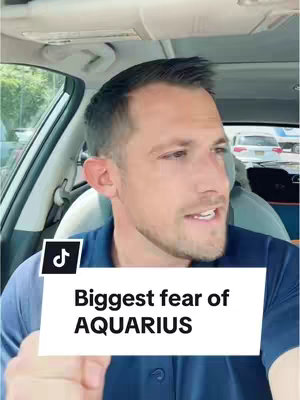 A man is sitting in the driver's seat of a car, looking at the camera. Overlay text reads 'Biggest fear of AQUARIUS' in a white box.