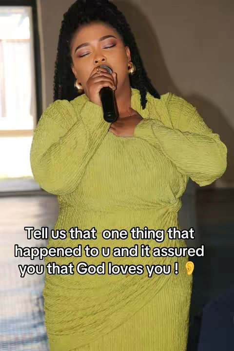 A vertical shot featuring a Black woman center frame. She is holding a microphone to her mouth, eyes closed and wearing a lime-green dress. The background is lightly blurred, suggesting an indoor setting. Text overlay sits below her.