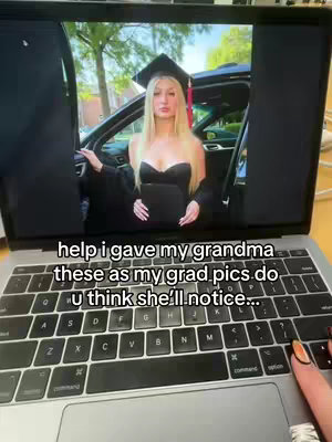 A laptop screen displays a photo of a woman in a graduation gown posing next to a car. The laptop is open on a desk, with a hand with manicured nails touching the trackpad. Text overlayed on the image asks if the grandma will notice the swapped photos.
