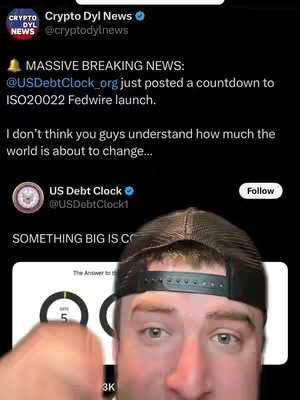 A selfie-style video featuring a man in the foreground looking directly at the camera. He's wearing a black baseball cap and the background is a screenshot of a Twitter post related to cryptocurrency. The post includes text and graphics, with a countdown to a specific event.
