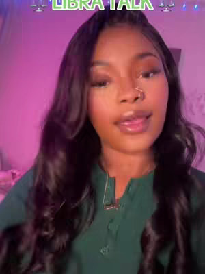The cover image features a young woman with long, dark wavy hair and a green top. She has a nose ring and is looking directly at the camera with a slight smile. The background has purple and pink lighting.