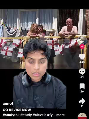 A video cover image shows a creator in the foreground, with a house in the background. Behind the creator, we see a house with other people. In the foreground, the creator is wearing a black hoodie and headphones. The creator is speaking to the camera. Behind the creator, we can see a series of houses and a group of people. They are standing behind a fence, with English flags. The sky is partially visible above the scene. The overall scene appears to be outdoors during the day with bright lighting.