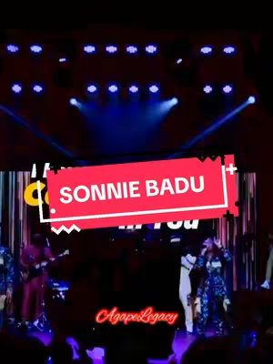The cover image shows a live performance on stage at a concert. The stage is well-lit with a large screen in the background and stage lights. The artist, Sonnie Badu, is featured in a large red and white text overlay. There are band members. A logo is present at the bottom.