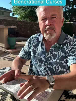 An older man sits outdoors with a Bible open in his lap and hands resting on it. He is wearing a patterned shirt and a watch. A text overlay reads 'Generational Curses' in a blue bar at the top.