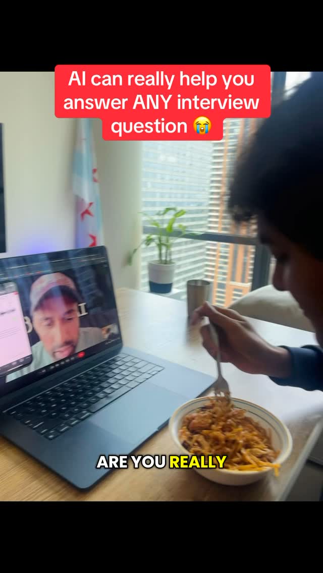 A person is capturing a screen recording of a video call on their laptop. The overlay states the video's core theme is on answering interview questions using AI, and an overlaid text on the image says 'ARE YOU REALLY'