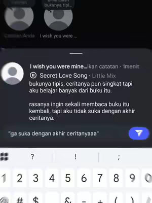 The cover image is a screenshot of a chat-like interface on a mobile device. The background is a dark grey, and a text bubble with white text is prominently displayed. Some elements of the image are slightly out of focus. The title of the content is "Secret Love Song - Little Mix". The text in the bubble discusses the creator's reading experience of a book which they found to be interesting, despite not liking the ending. At the bottom is the keyboard.